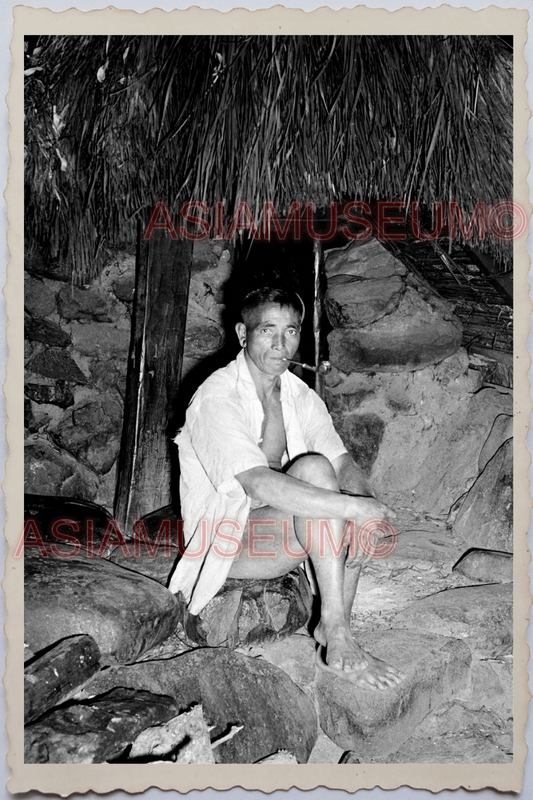 50s PHILIPPINES TRIBE MAN SMOKING PIPE PORTRAIT CAVEMEN HUT Vintage Photo 24182