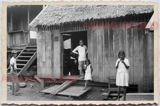 50s PHILIPPINES VILLAGE CHILDREN STILT HOUSE BARBER SHOP MAN Vintage Photo 29933